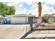 Charming single-story home features a well-maintained yard and a two-car garage, providing both curb appeal and practicality at 5424 Neosho St, Las Vegas, NV 89120