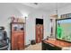Office space featuring a wooden desk and storage, showcasing potential for productivity at 5424 Neosho St, Las Vegas, NV 89120