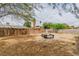 Backyard area with wooden fence and small fish pond at 5600 W Bartlett Ave, Las Vegas, NV 89108