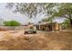 Backyard area with cinderblock fence and small fish pond at 5600 W Bartlett Ave, Las Vegas, NV 89108