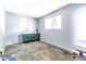 Bedroom area with gray walls, dresser and window at 5600 W Bartlett Ave, Las Vegas, NV 89108