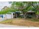 Single-story home with a two-car garage and xeriscaping in the front yard at 5600 W Bartlett Ave, Las Vegas, NV 89108