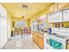 Bright kitchen with laminate countertops and white appliances at 5600 W Bartlett Ave, Las Vegas, NV 89108