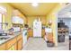 Open kitchen with laminate countertops and white appliances at 5600 W Bartlett Ave, Las Vegas, NV 89108