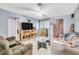 Inviting living room with tile floors, ceiling fan, and neutral paint at 5600 W Bartlett Ave, Las Vegas, NV 89108