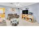 View of the living room with tile floors, ceiling fan, and neutral paint at 5600 W Bartlett Ave, Las Vegas, NV 89108