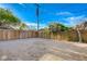 View of the spacious backyard with mature trees and potential for outdoor activities at 5904 Apple Valley Ln, Las Vegas, NV 89108