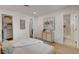 Bright bedroom with wood floors, open closet, and neutral decor, creating a serene space at 5904 Apple Valley Ln, Las Vegas, NV 89108