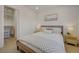 Comfortable bedroom features a calming decor, soft bedding and a well organized closet at 5904 Apple Valley Ln, Las Vegas, NV 89108