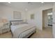 Bright bedroom showcases stylish decor, soft bedding, and access to a modern bathroom at 5904 Apple Valley Ln, Las Vegas, NV 89108