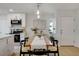 Dining area with stylish lighting fixtures, adjacent to the modern kitchen at 5904 Apple Valley Ln, Las Vegas, NV 89108