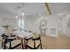 Dining area with wood table, views of the entryway, and a decorative mirror at 5904 Apple Valley Ln, Las Vegas, NV 89108