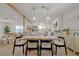 Open concept dining area leading to a stylish living room and modern kitchen at 5904 Apple Valley Ln, Las Vegas, NV 89108