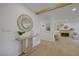 Well-lit hallway features a decorative mirror, wood beam, and flows into the living area at 5904 Apple Valley Ln, Las Vegas, NV 89108