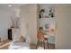 Home office area boasts custom cabinetry, a built-in desk, and a mini bar at 5904 Apple Valley Ln, Las Vegas, NV 89108