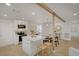 Bright, open kitchen with island, stainless steel appliances, and adjacent dining area with modern lighting at 5904 Apple Valley Ln, Las Vegas, NV 89108