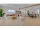 Open concept living room and dining area with modern decor and lots of natural light at 5904 Apple Valley Ln, Las Vegas, NV 89108