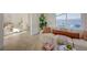 Cozy living room area with modern sofa and seamless flow to the backyard at 5904 Apple Valley Ln, Las Vegas, NV 89108