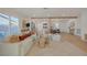 Bright living room with modern sofa, backyard access, and seamless flow to kitchen at 5904 Apple Valley Ln, Las Vegas, NV 89108