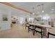 Bright, open-concept living and dining area with wood beams, fireplace, and lots of natural light at 5904 Apple Valley Ln, Las Vegas, NV 89108