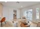 Inviting living room features sliding glass doors to the backyard and an open floor plan at 5904 Apple Valley Ln, Las Vegas, NV 89108
