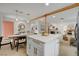 Open layout with kitchen island, dining space, and living area featuring a cozy fireplace at 5904 Apple Valley Ln, Las Vegas, NV 89108