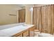 Bathroom featuring single sink vanity, and shower with curtain at 6032 S Pioneer Way, Las Vegas, NV 89113