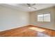 Bedroom featuring hardwood floors, neutral walls, and a ceiling fan at 6032 S Pioneer Way, Las Vegas, NV 89113