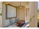 Relaxing front porch area with seating and an overhead light fixture at 6032 S Pioneer Way, Las Vegas, NV 89113