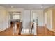 Upstairs hallway with hardwood floors and views of other rooms, including the laundry room at 6032 S Pioneer Way, Las Vegas, NV 89113