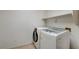 Bright laundry room with modern washer and dryer and convenient shelf at 6032 S Pioneer Way, Las Vegas, NV 89113