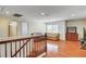 Bright living room features hardwood floors, neutral paint, and two sofas at 6032 S Pioneer Way, Las Vegas, NV 89113
