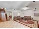 Open-concept living room with stairs, tile floors, neutral tones, and a view of adjacent living spaces at 6032 S Pioneer Way, Las Vegas, NV 89113