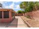 Backyard with patio featuring privacy wall and desert landscaping at 6056 Flowering Plum Ave, Las Vegas, NV 89142