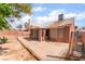 Backyard featuring patio, desert landscaping, and privacy wall at 6056 Flowering Plum Ave, Las Vegas, NV 89142