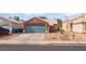 Charming single-story home with a well-maintained yard and a two-car garage and drought-resistant landscaping at 6056 Flowering Plum Ave, Las Vegas, NV 89142