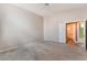 Large main bedroom with plush carpeting and an ensuite bathroom at 6056 Flowering Plum Ave, Las Vegas, NV 89142