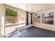 Enclosed sun room with carpet, windows, and sliding glass doors to the backyard at 6056 Flowering Plum Ave, Las Vegas, NV 89142