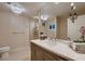 Modern bathroom with a large mirror, a decorative lighting fixture, and a glass-enclosed shower at 6316 Bluejay Way, Las Vegas, NV 89146