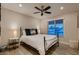 Bright bedroom with decorative pillows, lamps, and modern bedside tables on either side of the bed at 6316 Bluejay Way, Las Vegas, NV 89146