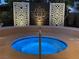 Inviting circular hot tub with custom privacy screens creates a tranquil backyard oasis at 6316 Bluejay Way, Las Vegas, NV 89146