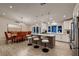 Spacious kitchen with an island, dining area, modern appliances, and lots of natural light at 6316 Bluejay Way, Las Vegas, NV 89146