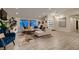 Cozy living room featuring a plush sectional sofa, modern rug, and bright windows at 6316 Bluejay Way, Las Vegas, NV 89146