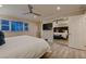 Bright main bedroom featuring a mirrored closet, contemporary furnishings, and wood-look tile at 6316 Bluejay Way, Las Vegas, NV 89146