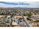 A neighborhood aerial showing various homes, landscaping and mountain views under a bright sky at 6520 Turtle Hill Rd, Las Vegas, NV 89110