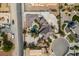 Aerial view of a sprawling home featuring a pool, meticulously landscaped grounds, and a large driveway at 6520 Turtle Hill Rd, Las Vegas, NV 89110