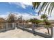 Elevated outdoor balcony with views of palm trees, landscaping and the blue sky at 6520 Turtle Hill Rd, Las Vegas, NV 89110