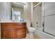 Bright bathroom boasts a vanity, toilet, and shower over bath with glass screen at 6520 Turtle Hill Rd, Las Vegas, NV 89110