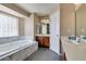 Large main bathroom features jetted tub, separate vanities, and modern fixtures at 6520 Turtle Hill Rd, Las Vegas, NV 89110