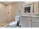 Modern bathroom featuring a vanity, toilet, and walk-in shower at 6520 Turtle Hill Rd, Las Vegas, NV 89110